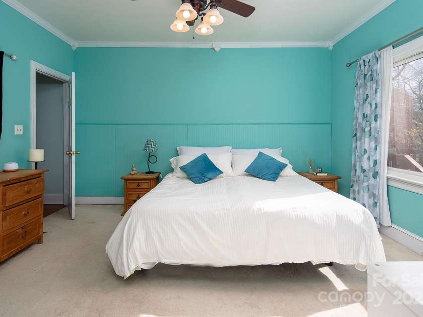 7007 Chapparall Lane, Charlotte, NC 28215.  MLS# CAR4223263, YatesRealty ID 16192. Private Primary Bedroom Retreat on Main Level with view of lush backyard