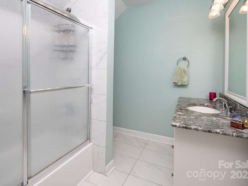7007 Chapparall Lane, Charlotte, NC 28215.  MLS# CAR4223263, YatesRealty ID 16192. Updated full bathroom upstairs
