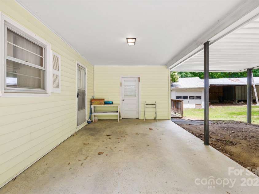 208 Lipe Road, Troutman, NC 28166.  MLS# CAR4263881, YatesRealty ID 16203. Carport - Entrance to Laundry Room