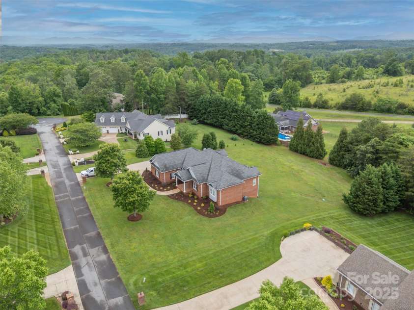 182 Kensington Drive, Forest City, NC 28043.  MLS# CAR4264053, YatesRealty ID 16207. View showing surrounding houses.