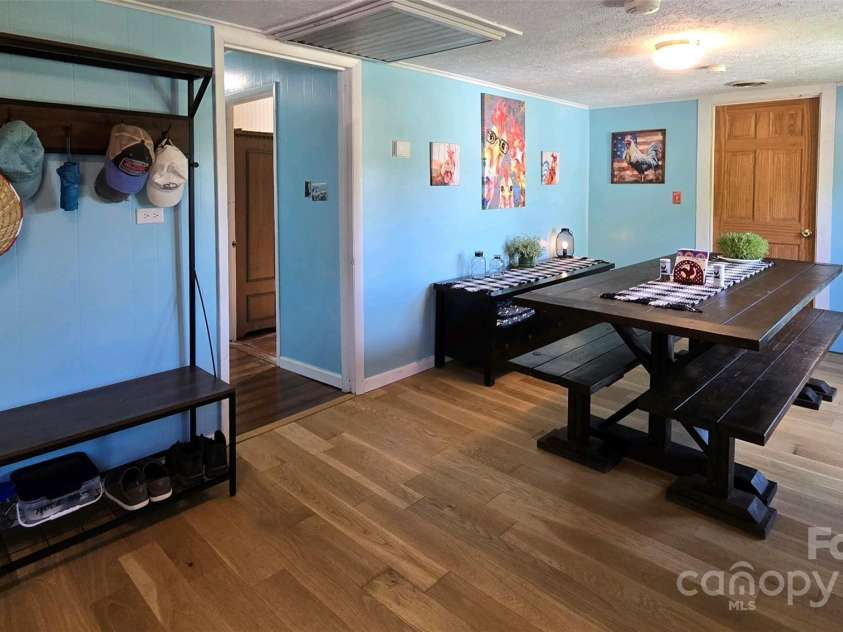 626 Fairview Loop, Hot Springs, NC 28743.  MLS# CAR4302454, YatesRealty ID 1621. Just inside the back door from the rear deck is a really great room! Entry, Dining, Laundry and entrance into the hallway to the bedrooms and living room.