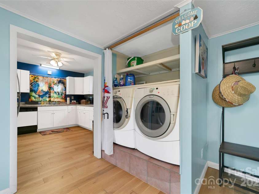 626 Fairview Loop, Hot Springs, NC 28743.  MLS# CAR4302454, YatesRealty ID 1621. Laundry area is complete with easy access washer and dryer and plenty of shelving for extras.