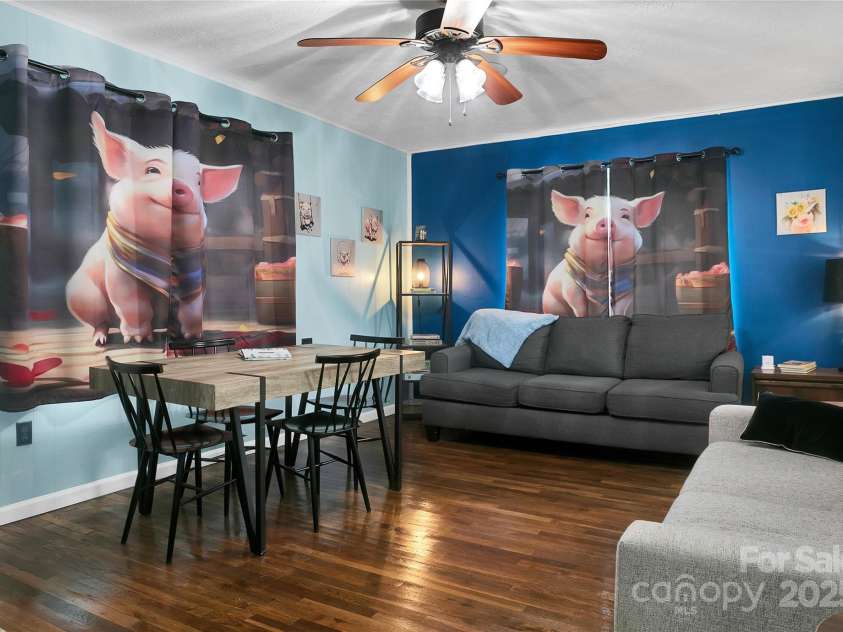 626 Fairview Loop, Hot Springs, NC 28743.  MLS# CAR4302454, YatesRealty ID 1621. Living Room, decorated with piggies, looking from the hallway.