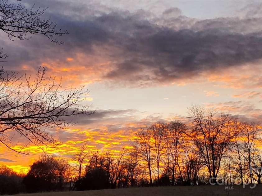 626 Fairview Loop, Hot Springs, NC 28743.  MLS# CAR4302454, YatesRealty ID 1621. Sunsets are also incredible to the west of the house, from both the front porch and the rear deck / hot tub!