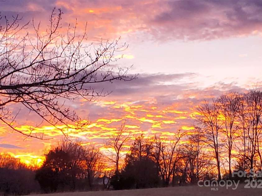 626 Fairview Loop, Hot Springs, NC 28743.  MLS# CAR4302454, YatesRealty ID 1621. Sunsets are also incredible to the west of the house, from both the front porch and the rear deck / hot tub!