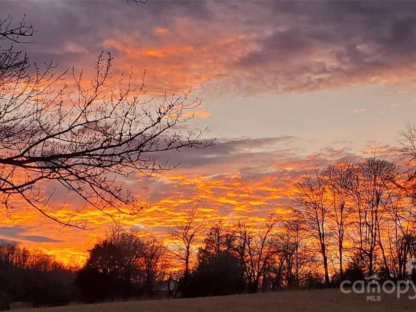 626 Fairview Loop, Hot Springs, NC 28743.  MLS# CAR4302454, YatesRealty ID 1621. Sunsets are also incredible to the west of the house, from both the front porch and the rear deck / hot tub!