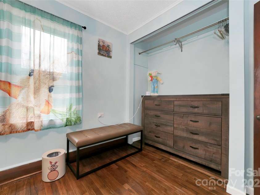 626 Fairview Loop, Hot Springs, NC 28743.  MLS# CAR4302454, YatesRealty ID 1621. The middle bedroom is alive with bunny rabbits in every corner! Light and bright with beautiful oak hardwood floors.