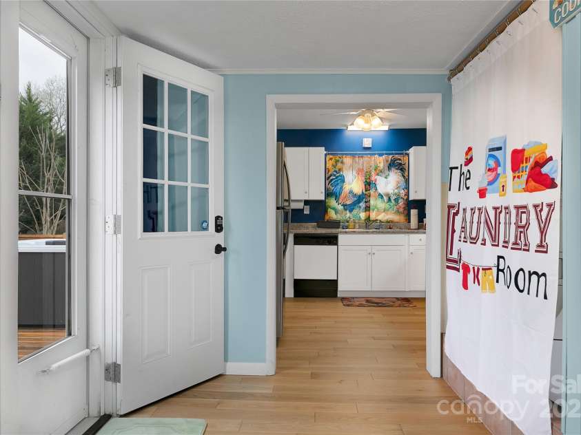 626 Fairview Loop, Hot Springs, NC 28743.  MLS# CAR4302454, YatesRealty ID 1621. The rear deck door brings you into the dining room on the right, kitchen on the left.