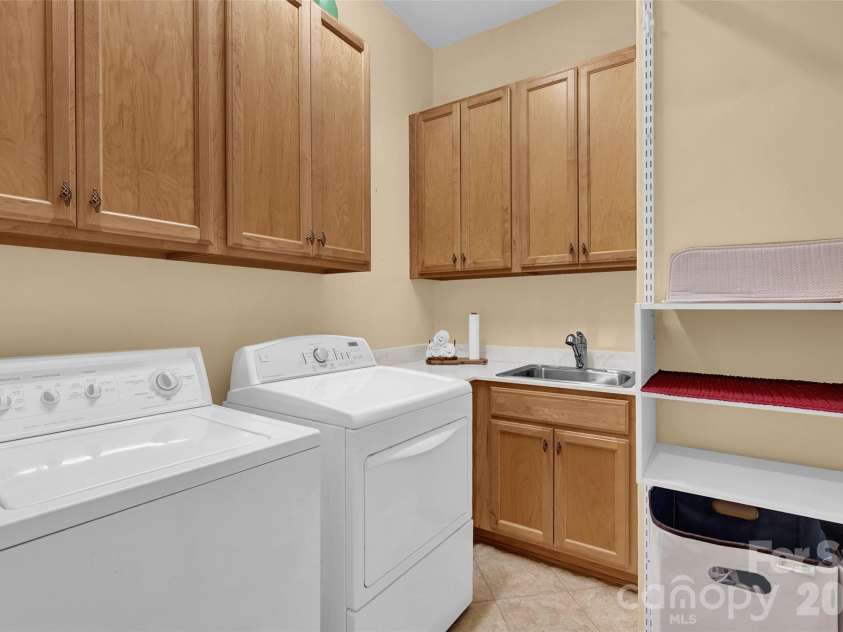 105 Tuskarora Point Lane, Mooresville, NC 28117.  MLS# CAR4325072, YatesRealty ID 16219. Laundry Room w/ Ample Storage