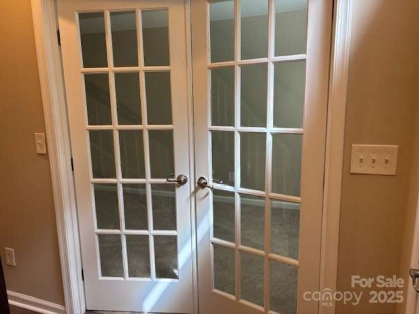 13838 Winmau Lane, Huntersville, NC 28078.  MLS# CAR4256068, YatesRealty ID 16237. Office or flex space at the front door, ground level, new carpet, accommodated by a 1/2 bath and easy access to the garage