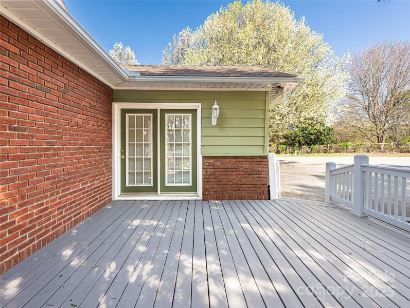1305 Pisgah Highway, Candler, NC 28715.  MLS# CAR4245961, YatesRealty ID 16242. Back porch with easy access to laundry room entry.