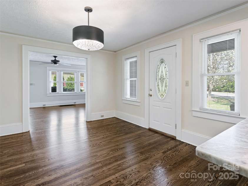 1305 Pisgah Highway, Candler, NC 28715.  MLS# CAR4245961, YatesRealty ID 16242. Dining room open the family room & kitchen.