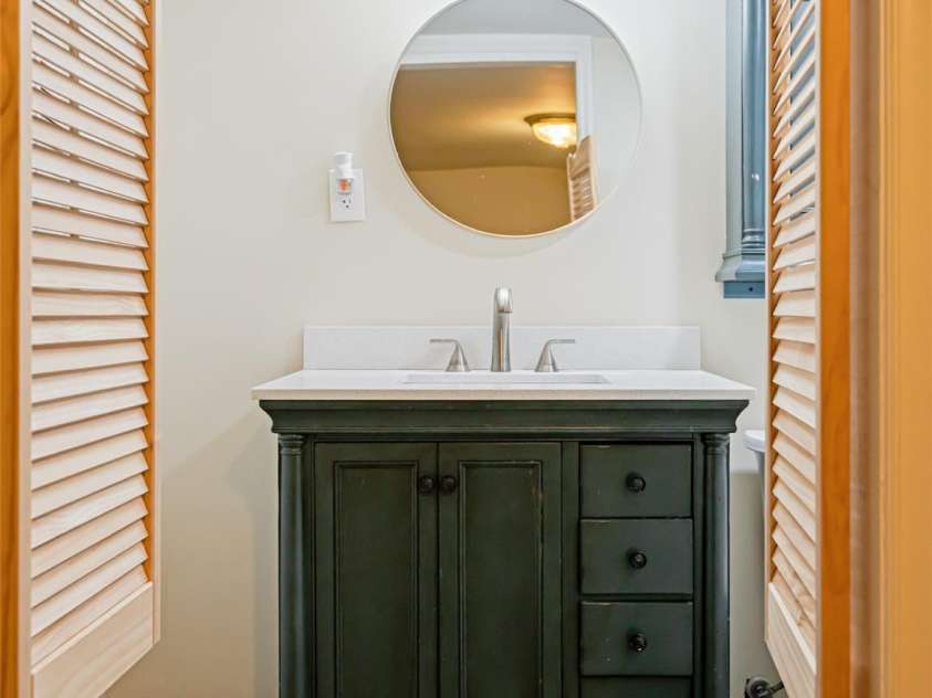 1305 Pisgah Highway, Candler, NC 28715.  MLS# CAR4245961, YatesRealty ID 16242. Full bath on basement level, perfect to clean up after yard work.