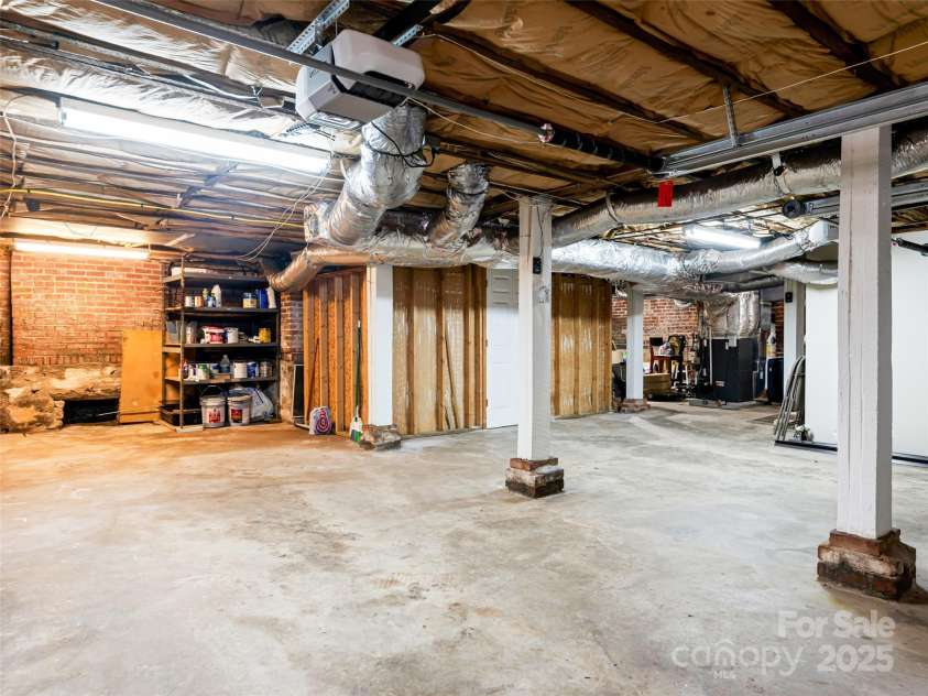 1305 Pisgah Highway, Candler, NC 28715.  MLS# CAR4245961, YatesRealty ID 16242. Huge unfinished space, room for a workshop