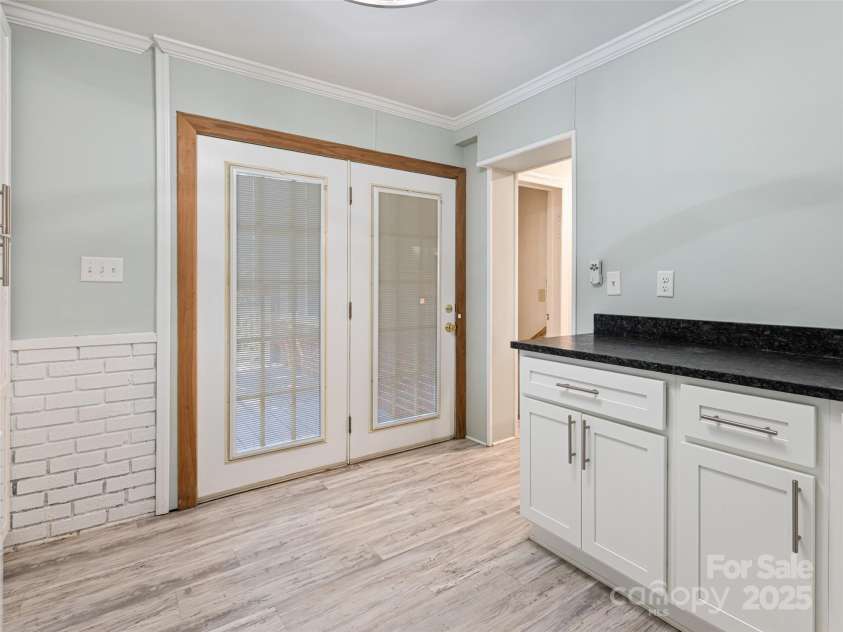 1305 Pisgah Highway, Candler, NC 28715.  MLS# CAR4245961, YatesRealty ID 16242. Lots of light and door to back porch.