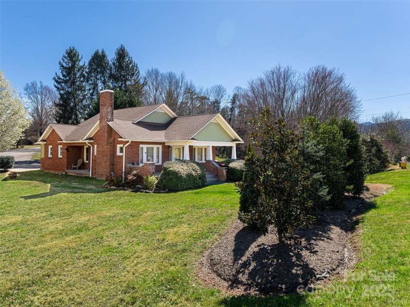 1305 Pisgah Highway, Candler, NC 28715.  MLS# CAR4245961, YatesRealty ID 16242. Lovely landscaping