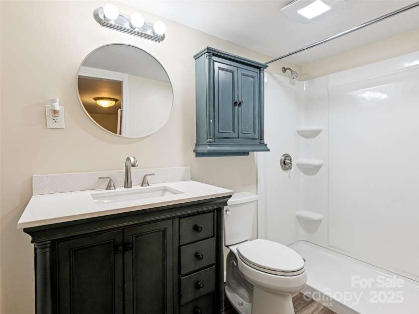 1305 Pisgah Highway, Candler, NC 28715.  MLS# CAR4245961, YatesRealty ID 16242. Lower level bathroom