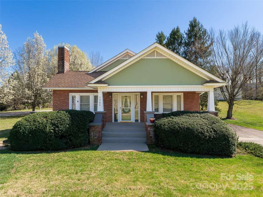 1305 Pisgah Highway, Candler, NC 28715.  MLS# CAR4245961, YatesRealty ID 16242. Perfect porch  for sipping a glass of wine or ice tea.