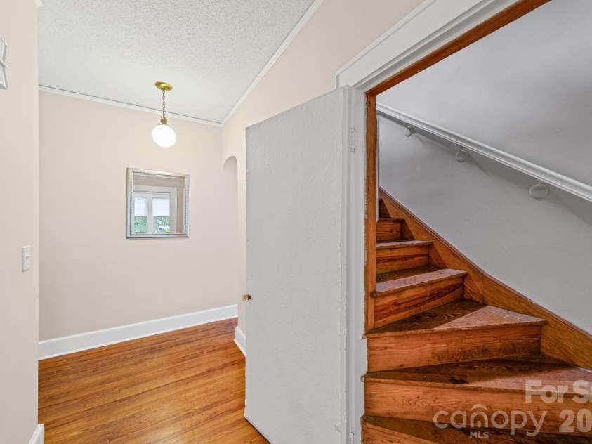 729 Montgomery Avenue, Albemarle, NC 28001.  MLS# CAR4375078, YatesRealty ID 16253. Hallway and attic stairs
