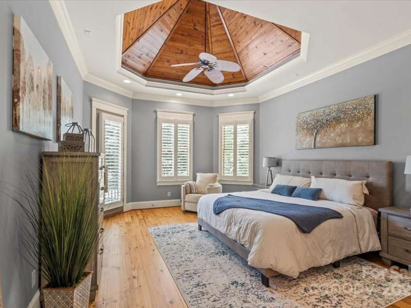 106 Kent Court, Mooresville, NC 28117.  MLS# CAR4262934, YatesRealty ID 16257. Primary bedroom with views and entrance to  pool area