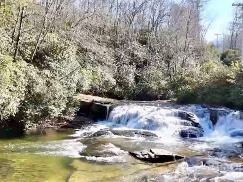 262 Rooster Cove, Brevard, NC 28712.  MLS# CAR4332799, YatesRealty ID 1626. The French Broad River, just across the road from the driveway