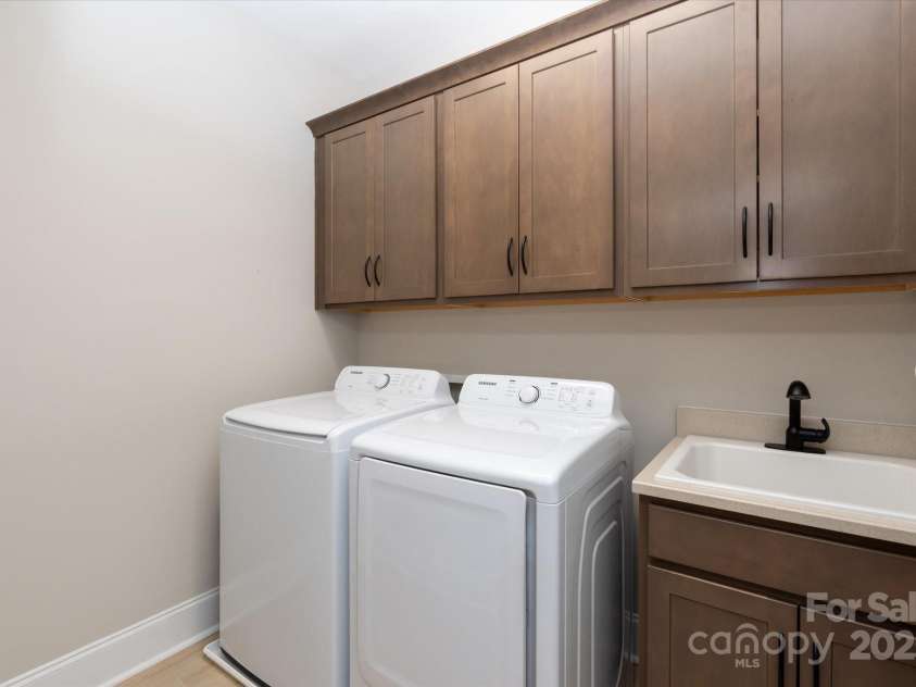 20216 Shaffer Bach Lane, Charlotte, NC 28277.  MLS# CAR4264477, YatesRealty ID 16262. Upstairs Laundry with Storage