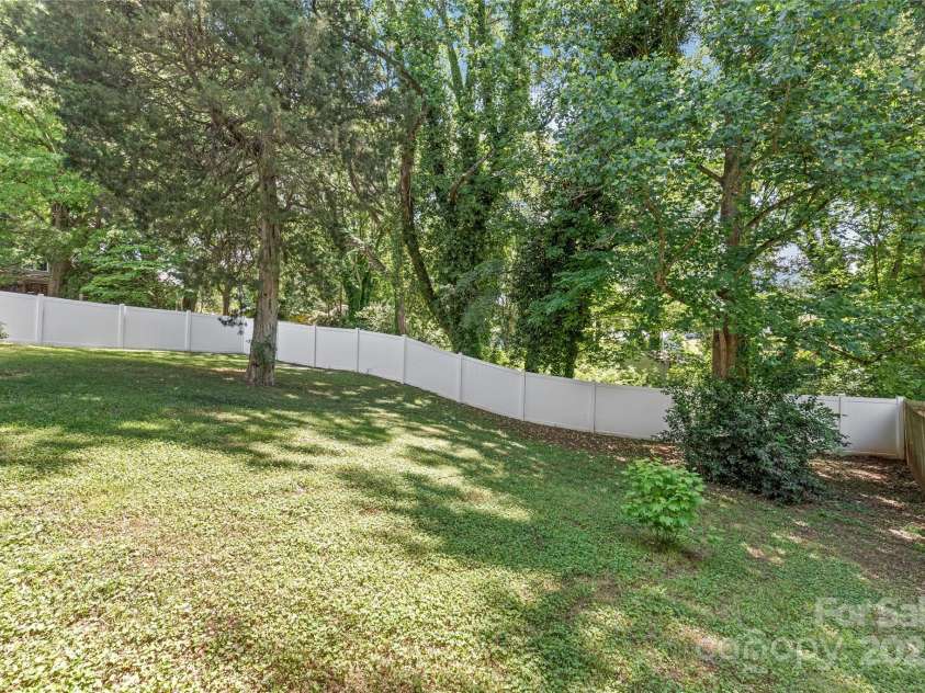 219 Lee Street, Fort Mill, SC 29715.  MLS# CAR4257682, YatesRealty ID 16267. From gardening to parties, the backyard offers enjoyment and creativity.