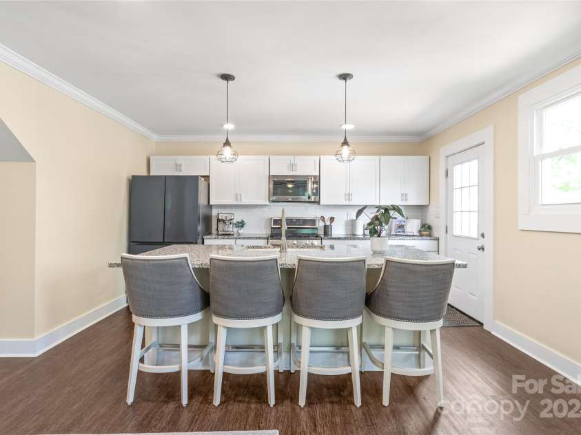 219 Lee Street, Fort Mill, SC 29715.  MLS# CAR4257682, YatesRealty ID 16267. The seller’s update to the island brings a fresh look and even better flow to this chef’s kitchen.