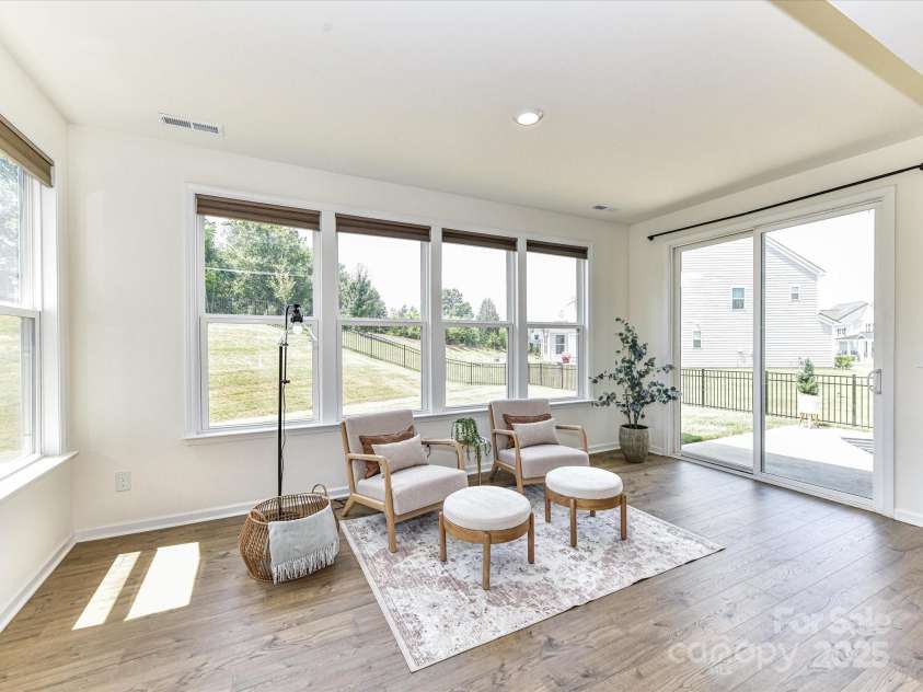 104 Hemlock Cove Court, Mooresville, NC 28117.  MLS# CAR4280117, YatesRealty ID 16272. Sunroom features amazing natural light & patio access!