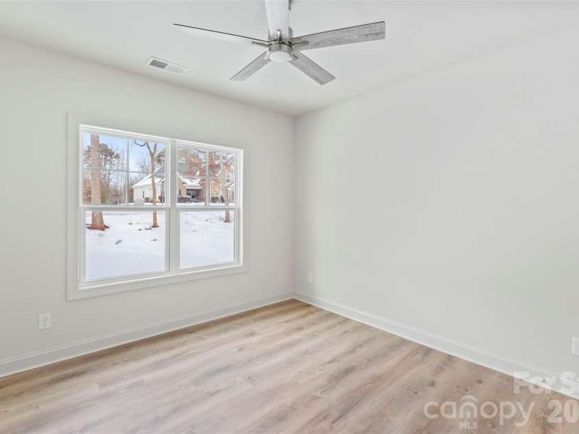 7540 Deer Track Drive, Denver, NC 28037.  MLS# CAR4343994, YatesRealty ID 16276. Front bedroom. A full guest suite