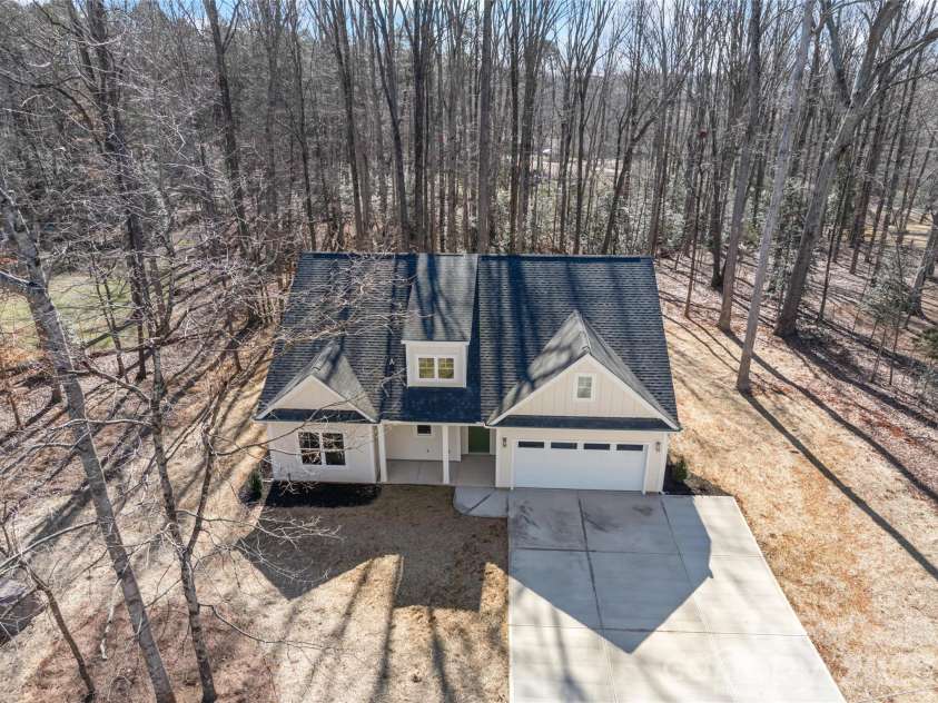 7540 Deer Track Drive, Denver, NC 28037.  MLS# CAR4343994, YatesRealty ID 16276. Most developers/ builders clear-cut all the trees. Nature rules here.