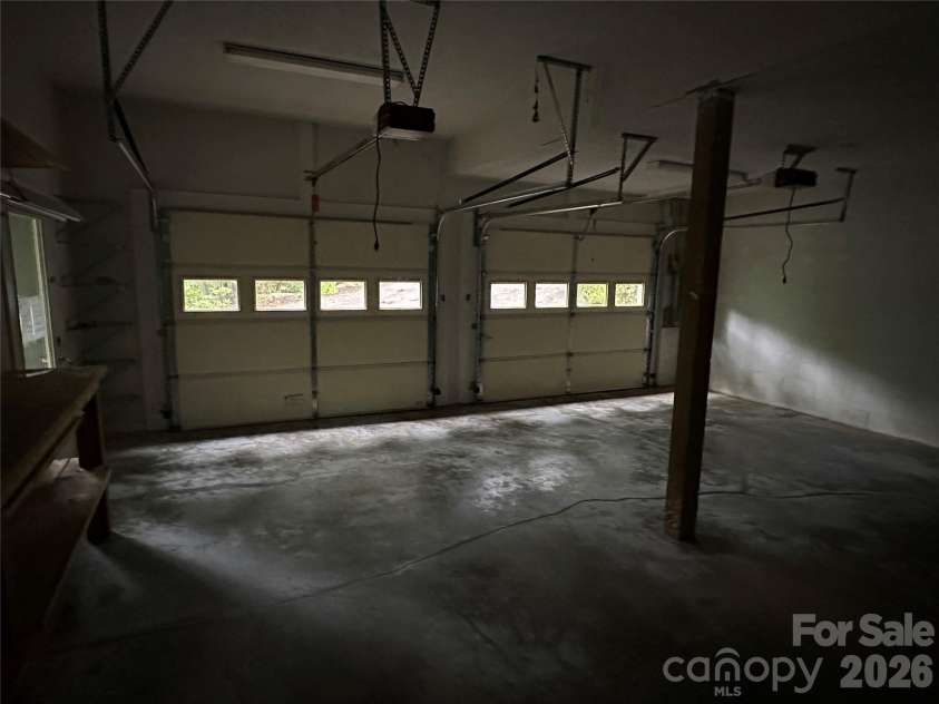 94 Blackberry Trail, Sapphire, NC 28774.  MLS# CAR4352189, YatesRealty ID 16281. Basement Garage