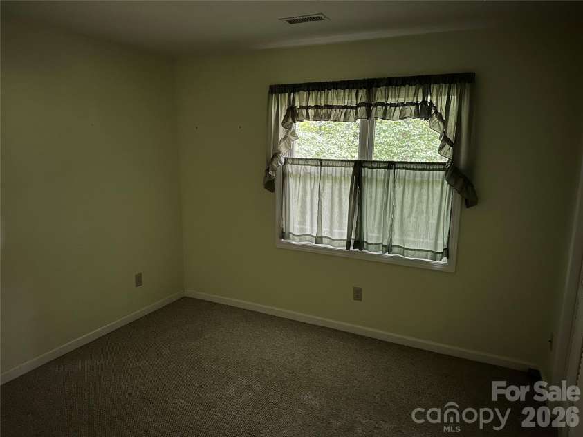 94 Blackberry Trail, Sapphire, NC 28774.  MLS# CAR4352189, YatesRealty ID 16281. Basement Guest Room 