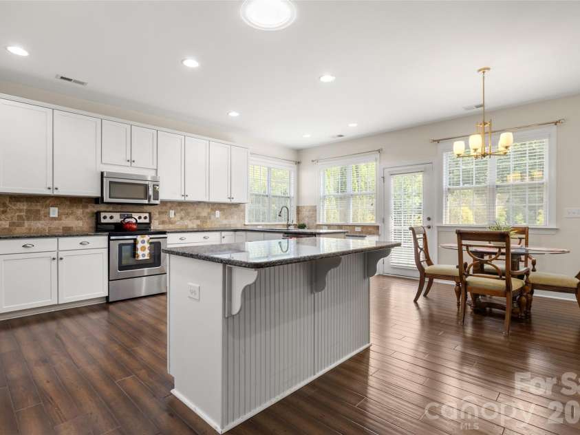 12728 Meetinghouse Drive, Cornelius, NC 28031.  MLS# CAR4408825, YatesRealty ID 16284. Kitchen island seating