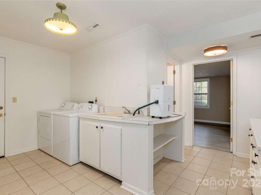 1010 Indian Hill Road, Hendersonville, NC 28791.  MLS# CAR4187228, YatesRealty ID 16286. Laundry area