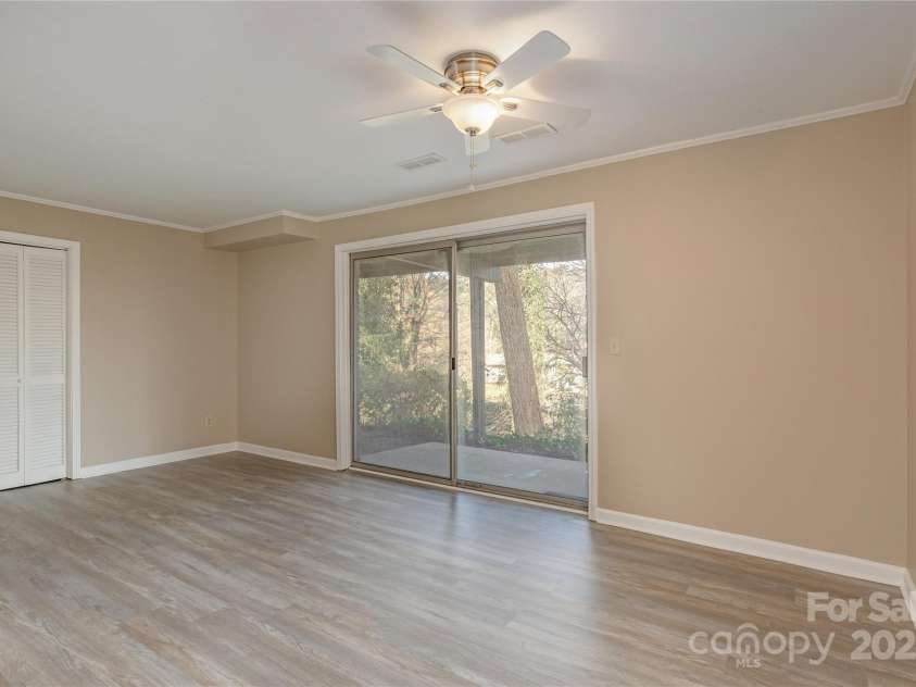 1010 Indian Hill Road, Hendersonville, NC 28791.  MLS# CAR4187228, YatesRealty ID 16286. Lower level access to patio with lake view