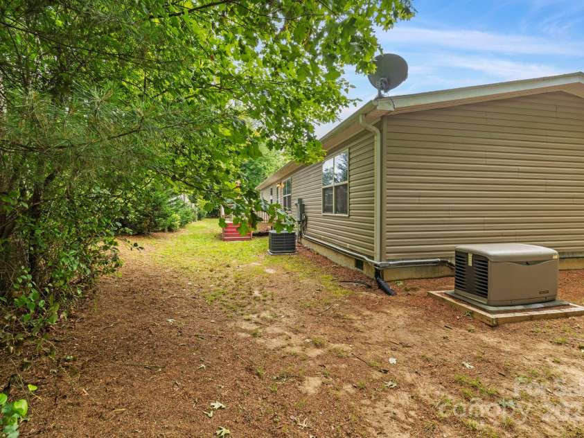 255 Jackson Loop Road, Flat Rock, NC 28731.  MLS# CAR4247351, YatesRealty ID 16288. Back of house