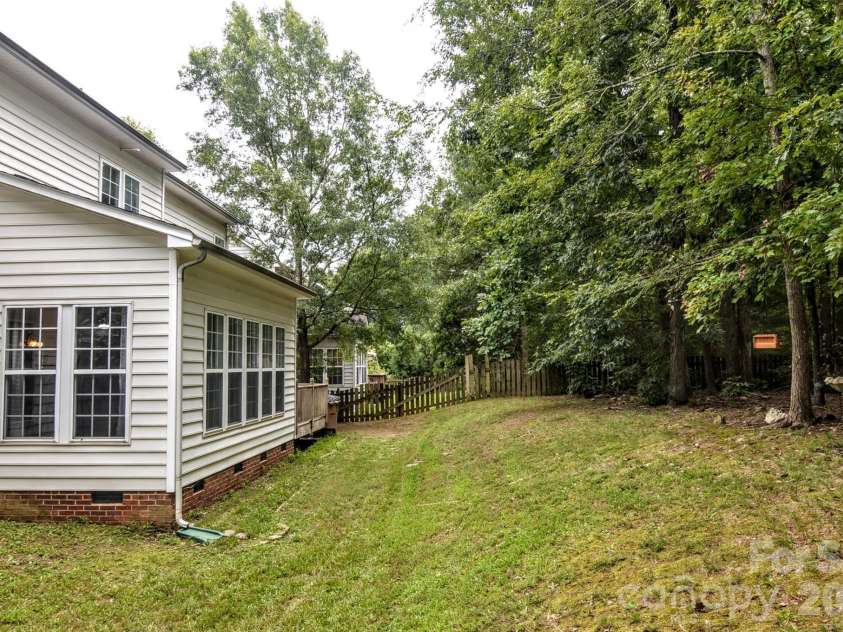 2035 Hollyhedge Lane, Indian Trail, NC 28079.  MLS# CAR4374554, YatesRealty ID 16289. Rear view with yard