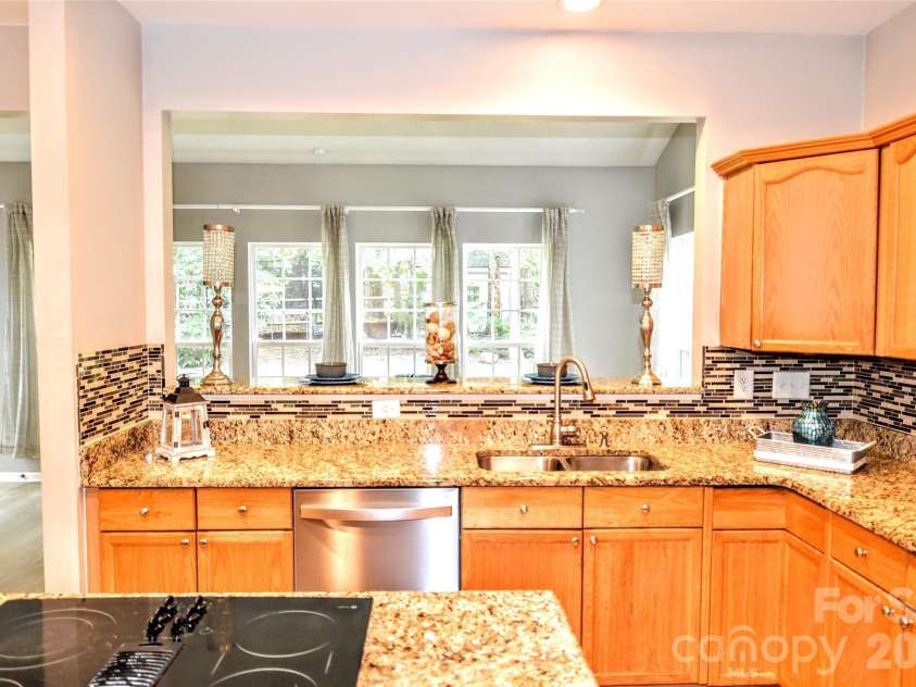 2035 Hollyhedge Lane, Indian Trail, NC 28079.  MLS# CAR4374554, YatesRealty ID 16289. View into sunroom from kitchen