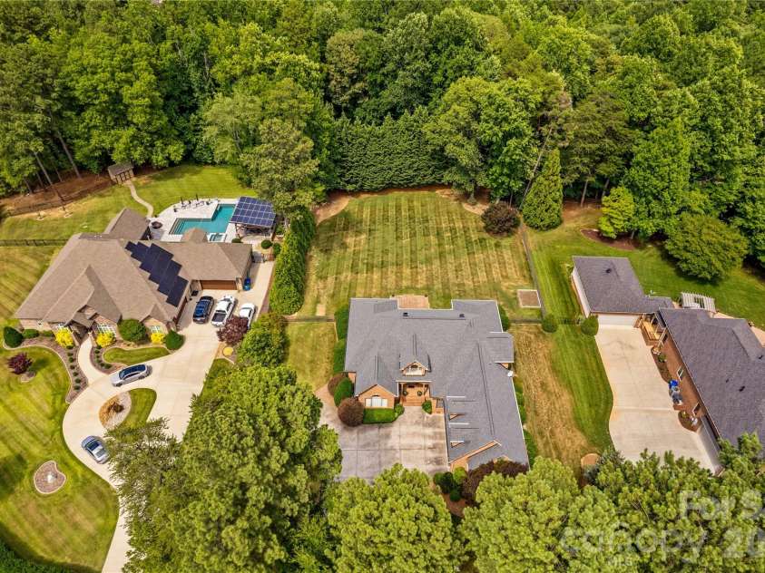 107 Kenway Loop, Mooresville, NC 28117.  MLS# CAR4398278, YatesRealty ID 16293. Buffer of Woods Behind Home