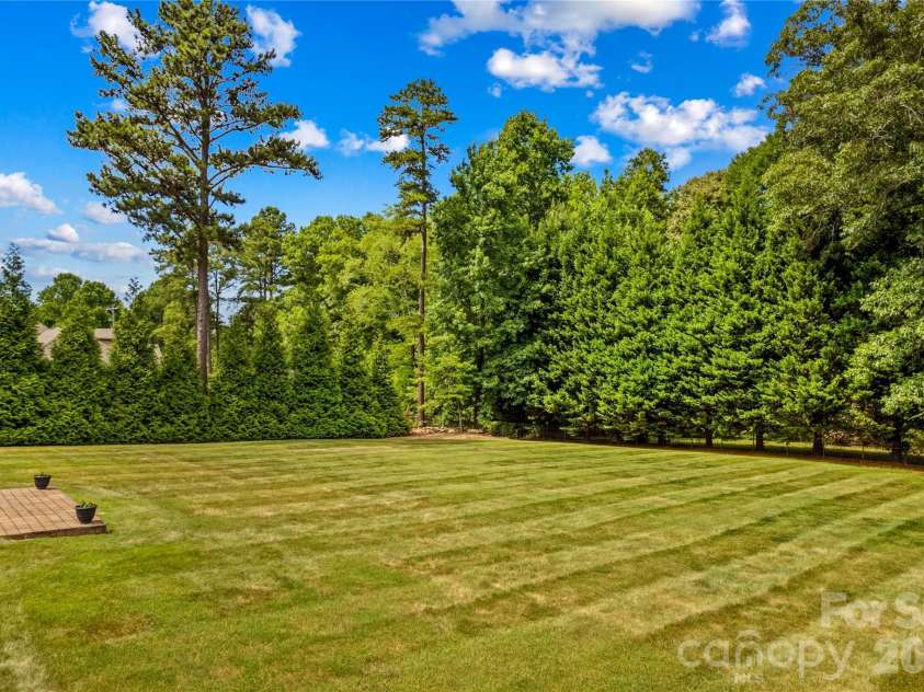 107 Kenway Loop, Mooresville, NC 28117.  MLS# CAR4398278, YatesRealty ID 16293. Level Back Yard