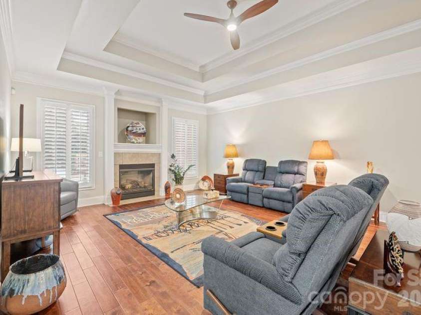 17426 Springwinds Drive, Cornelius, NC 28031.  MLS# CAR4333275, YatesRealty ID 16307. Great room with inviting fireplace