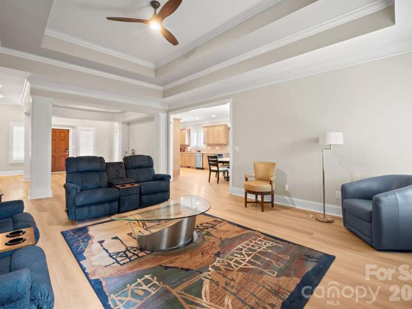 17426 Springwinds Drive, Cornelius, NC 28031.  MLS# CAR4333275, YatesRealty ID 16307. Great room with new LVP flooring