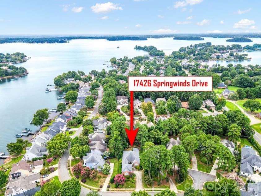 17426 Springwinds Drive, Cornelius, NC 28031.  MLS# CAR4333275, YatesRealty ID 16307. House shown across from lake