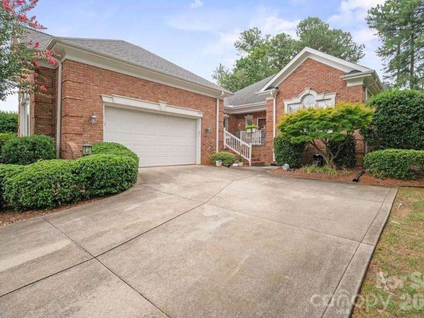 17426 Springwinds Drive, Cornelius, NC 28031.  MLS# CAR4333275, YatesRealty ID 16307. Shows courtyard style garage with keypad entry