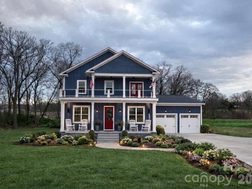 7217 Tesh Road, Monroe, NC 28110.  MLS# CAR4263981, YatesRealty ID 16313. Front of house and Landscape- AI generated