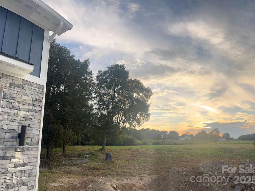 7217 Tesh Road, Monroe, NC 28110.  MLS# CAR4263981, YatesRealty ID 16313. Sunset from front porch