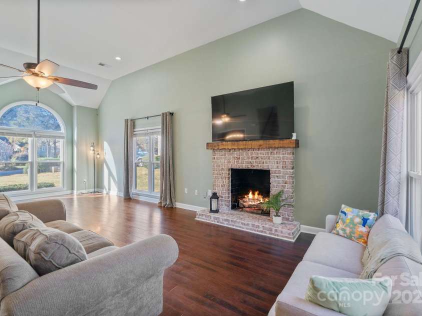 123 Southhaven Drive, Mooresville, NC 28117.  MLS# CAR4322533, YatesRealty ID 16318. Cozy and bright gas log brick fireplace with mantel.