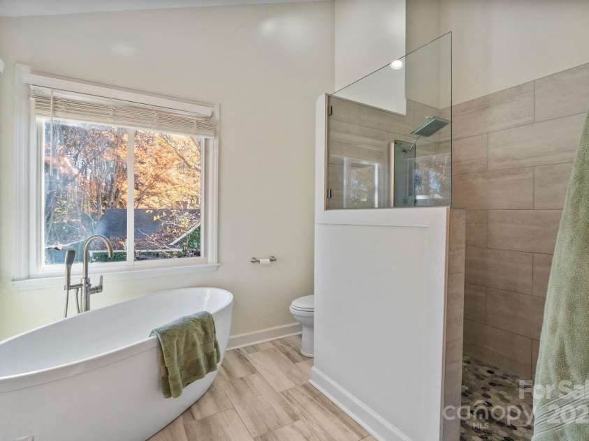 123 Southhaven Drive, Mooresville, NC 28117.  MLS# CAR4322533, YatesRealty ID 16318. Soaking tub and walk in shower make for a spa like experience 