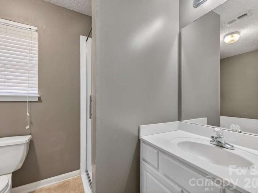 7124 Rumple Road, Charlotte, NC 28262.  MLS# CAR4337483, YatesRealty ID 16326. Primary Bathroom